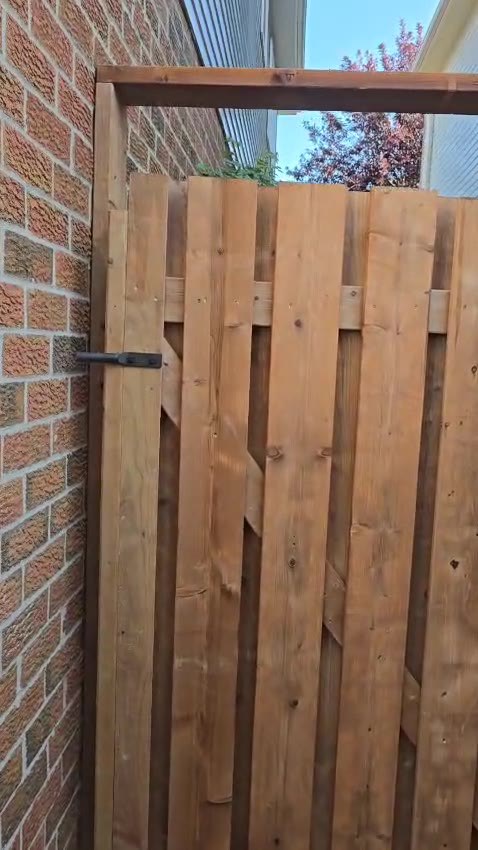 Wood fence gate with hinge and latch hardware